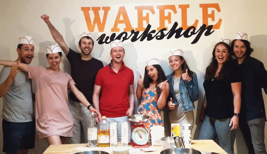 Friends enjoying a group activity at the Waffle Workshop in Brussels
